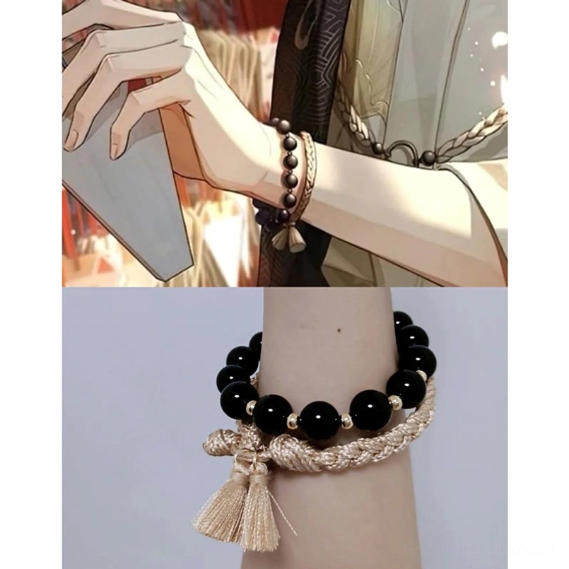 model wearing black onyx tassel string bracelet close up view