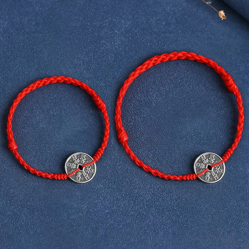 Black braided protective cord bracelet with sterling silver coin