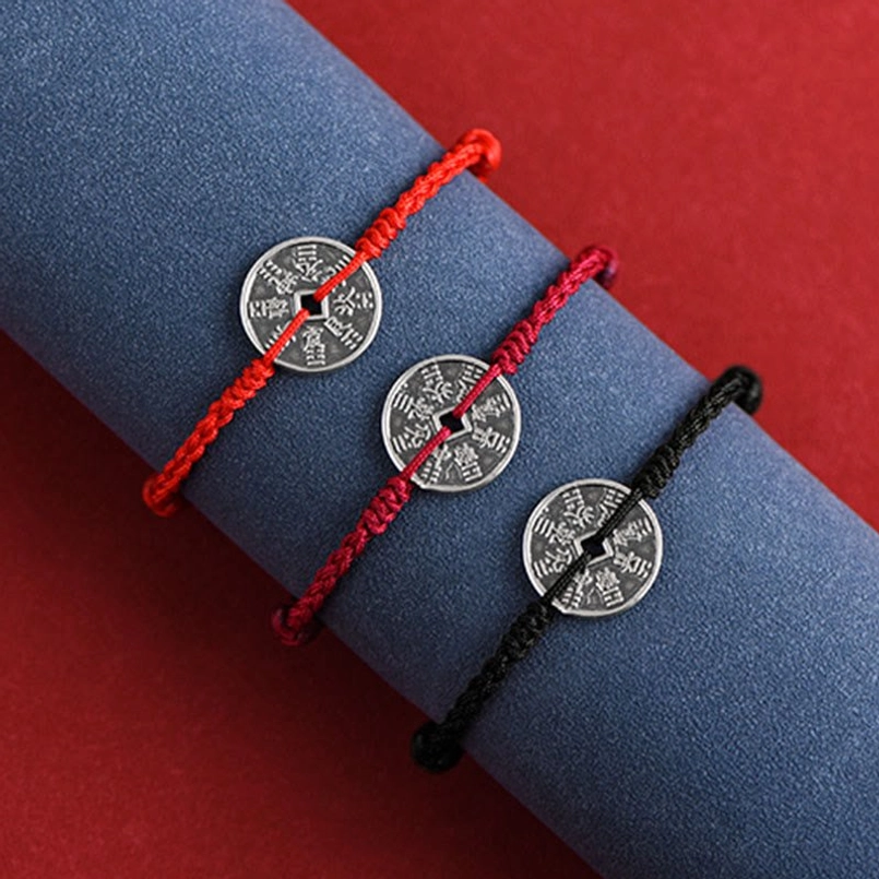 Black woven protective cord bracelet with antique square-hole silver coin detail