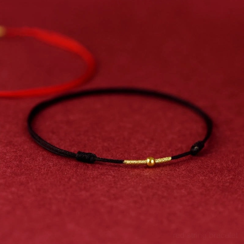 Black woven red string bracelet with golden bead accents and red companion piece