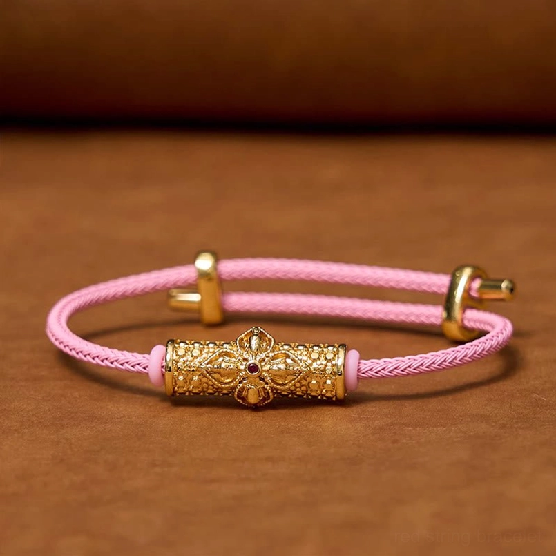 Black string luck bracelet variant showing copper flower charm and adjustable design