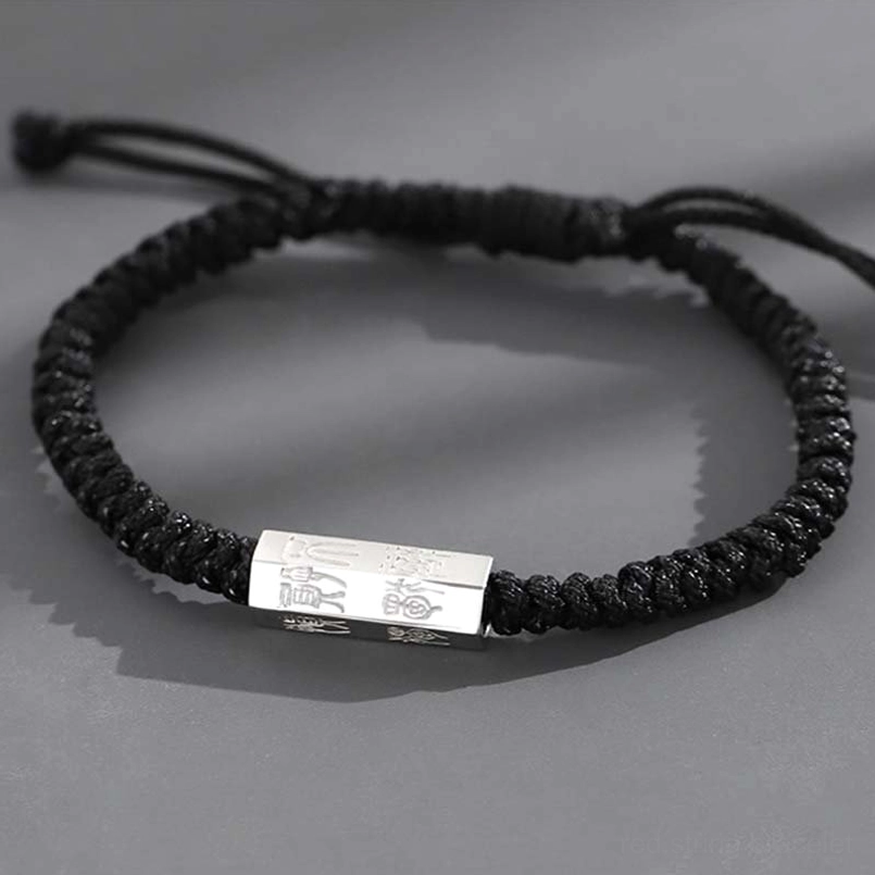 Black braided string bracelet with engraved 925 sterling silver charm top view