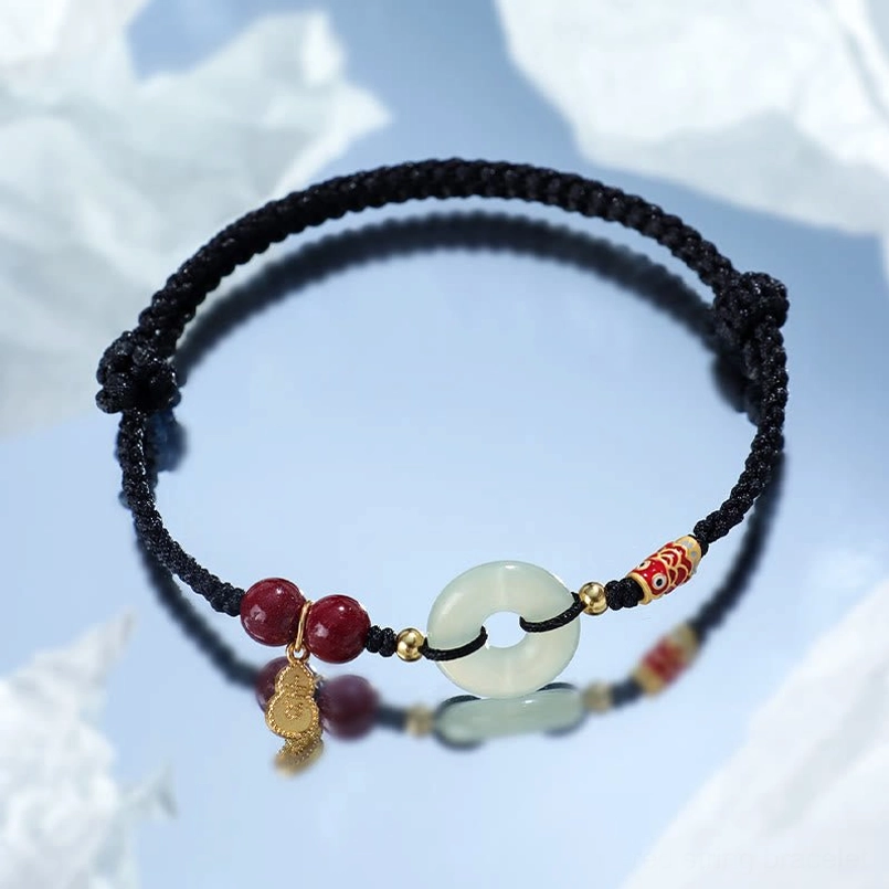 Black string protection bracelet worn on wrist casual daily style display