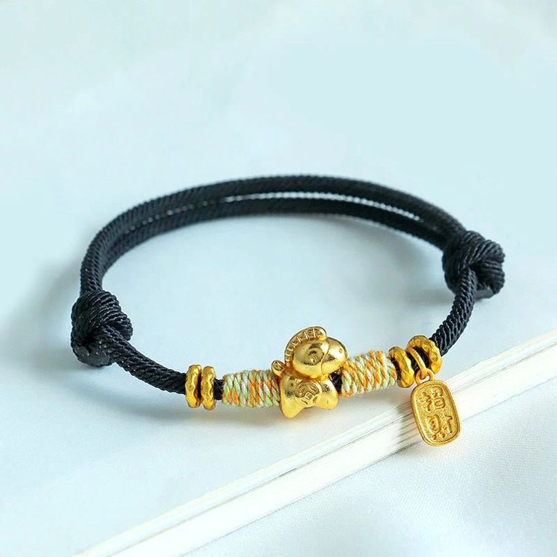 Black braided horse zodiac bracelet with gold charm close up detail