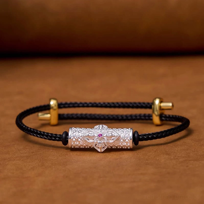 Black string protection bracelet with silver metal and colorful flower bead design