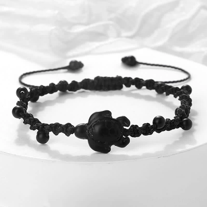 Black turtle woven rope bracelet with adjustable closure knots