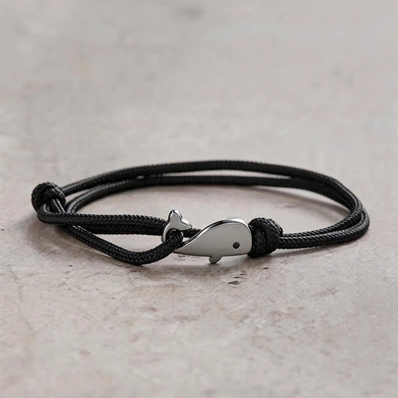 Black double wrap braided whale charm bracelet with silver metal whale pendant