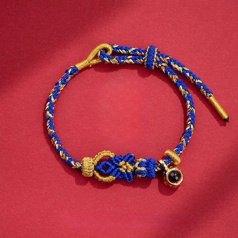 Blue gold braided Buddha knot red string bracelet with black projection stone charm