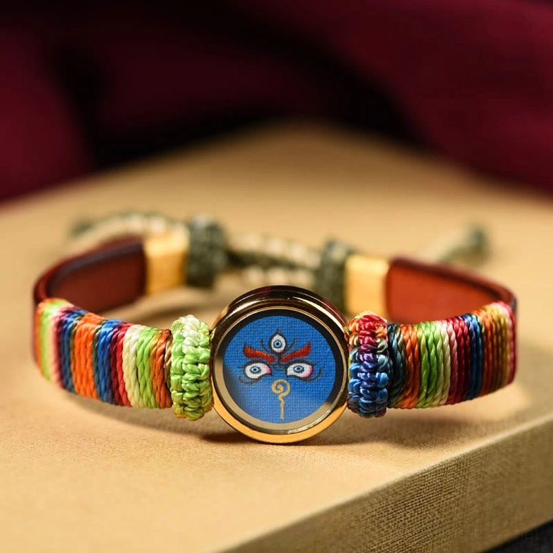 Blue Jambhala eye blessing bracelet front display with brown leather accent