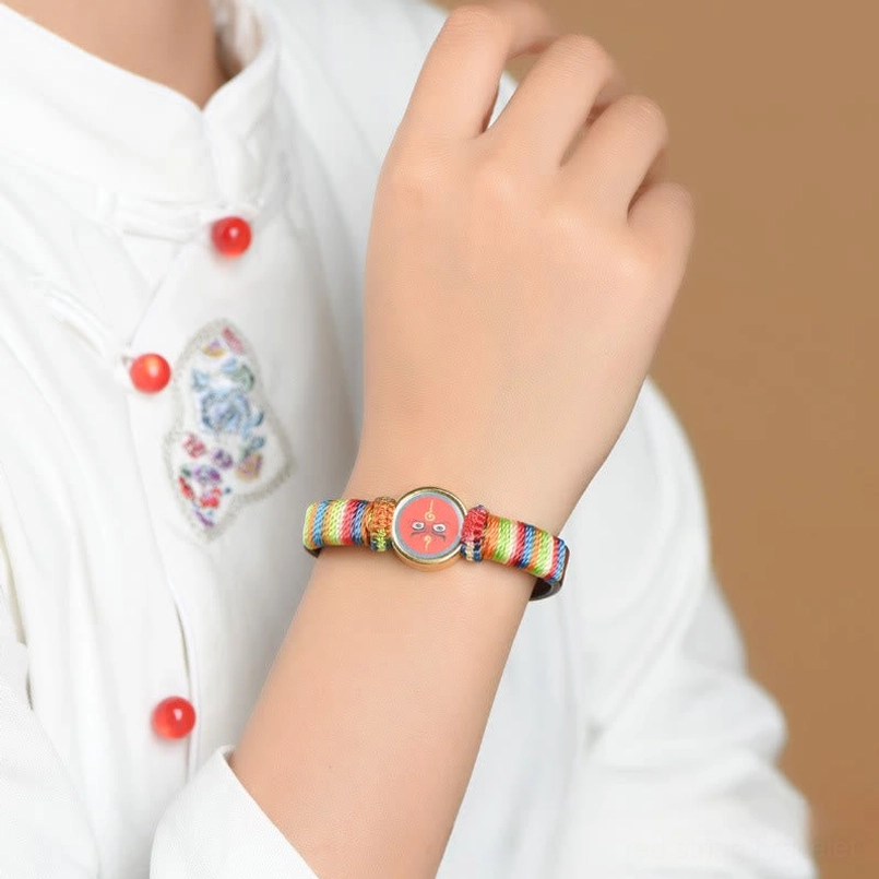Blue Jambhala eye blessing bracelet with rainbow woven rope and adjustable fit