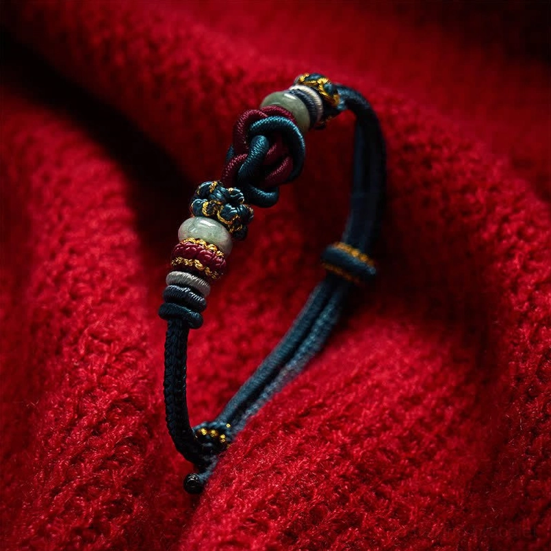 Blue red heart knot bracelet worn on wrist demonstrating natural wear style