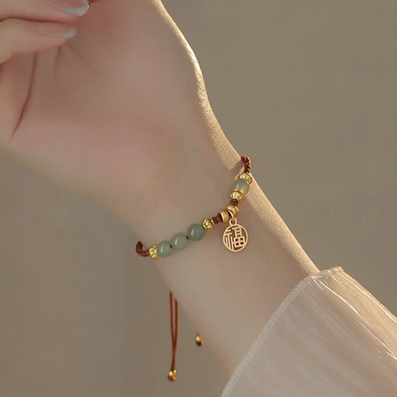 Handmade braided red string bracelet with jade beads and fu charm