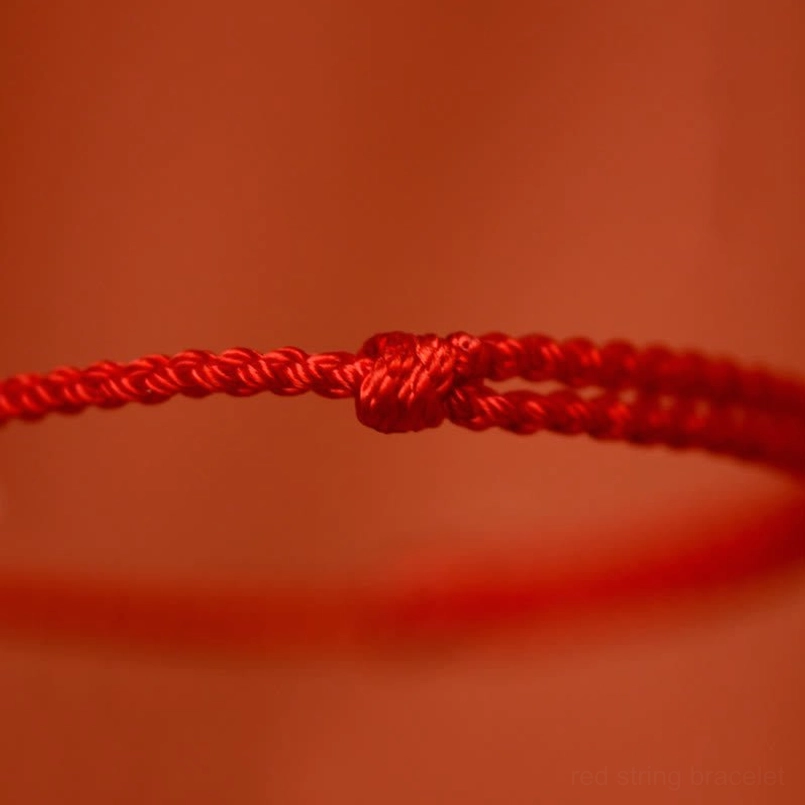 Braided red jewelry cord with knotted fastening detail for Year of the Horse bracelet