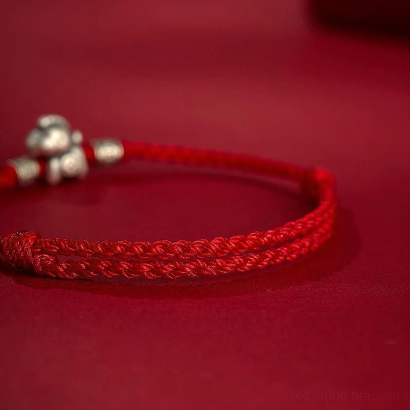 Partial close up of twisted braided red cord texture for zodiac horse bracelet