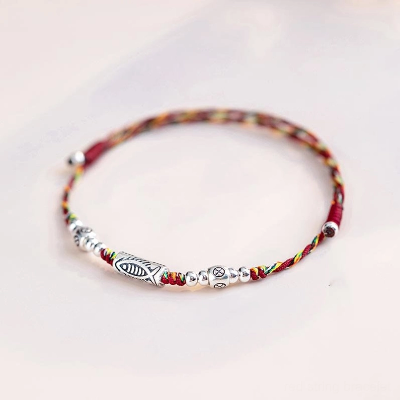 Multicolored woven cord koi fish bracelet with sterling silver charm and round beads detail