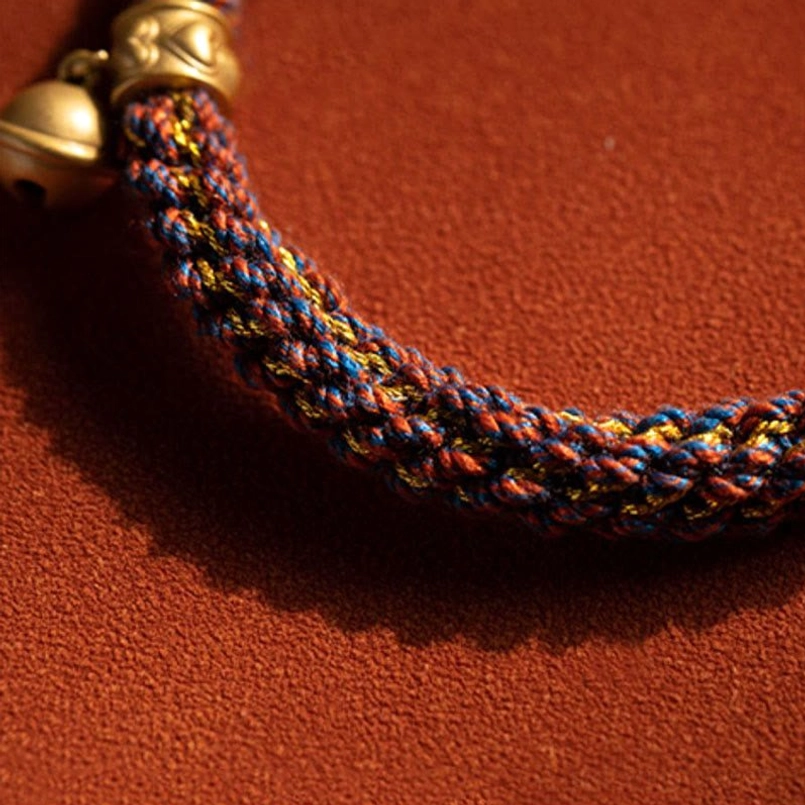 Braided Red String with Silver Bell Clasp - Natal Buddha Bracelet Close-up