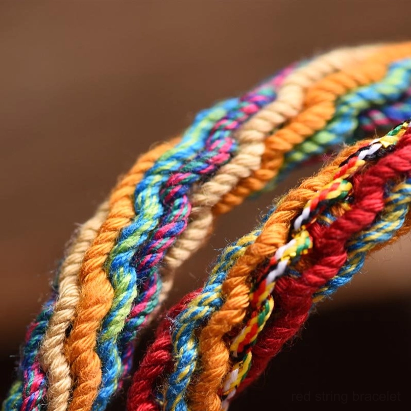 Macro close-up of twisted multicolor cotton rope weaving on pixiu family bracelet