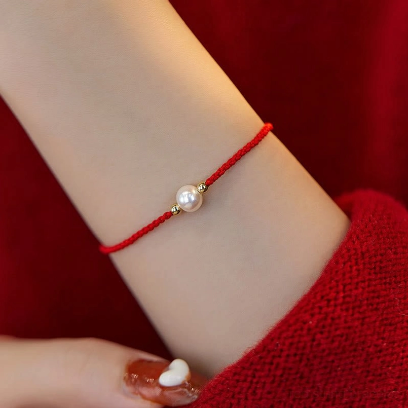 Bright red pearl string bracelet single white pearl gold spacer beads worn on wrist