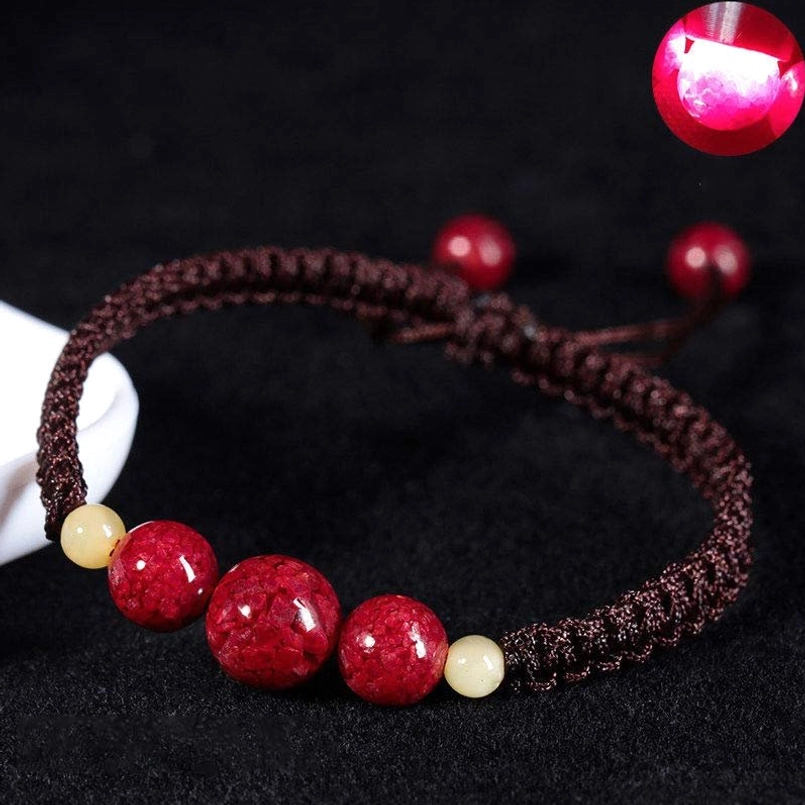 Brown cinnabar blessing bracelet with braided rope, natural beads, and adjustable tassel closure