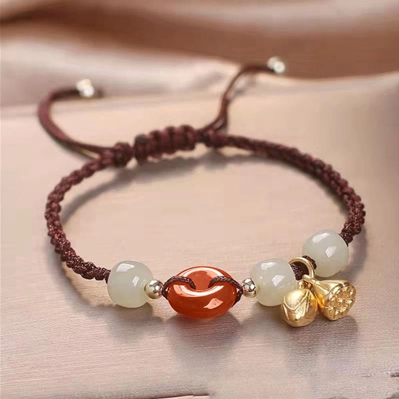 Brown braided red string bracelet red agate peace buckle jade beads on satin background