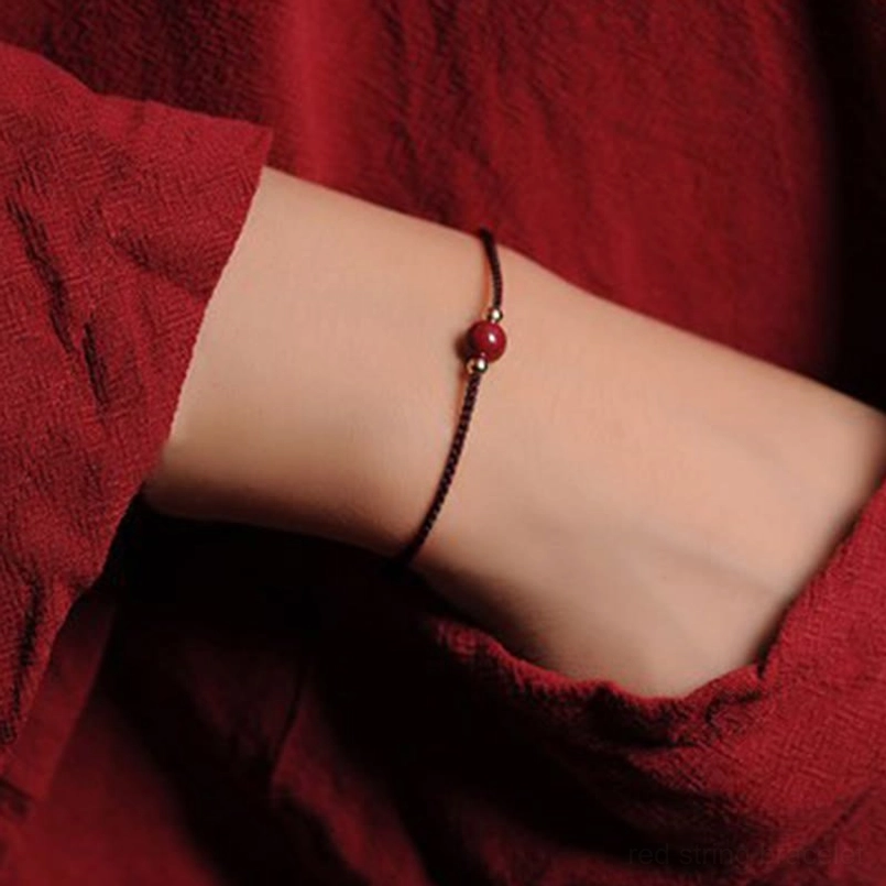 Brown cord single natural cinnabar bead braided bracelet product shot