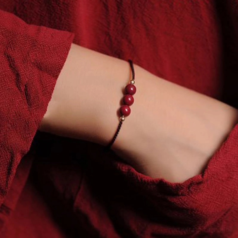 Brown cord 3 natural cinnabar beads blessing bracelet top view