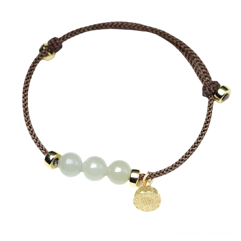 Brown jade lotus bracelet with gold charm and adjustable knot on clean white surface