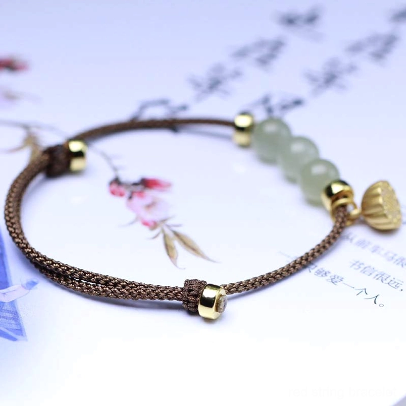 Brown woven string jade bracelet featuring lotus seed pod pendant with three jade beads