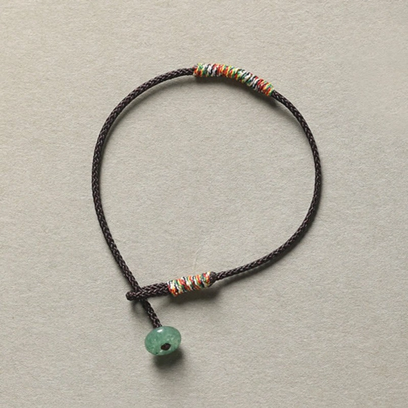 Brown Tibetan handmade braided bracelet with green aventurine stone and woven rope design
