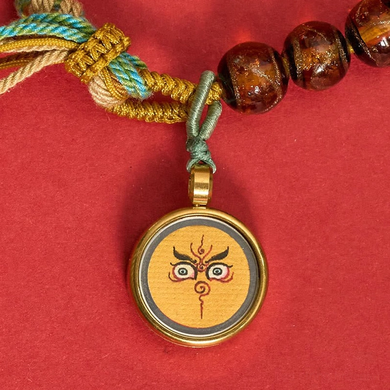 Tibetan Buddha eye protection bracelet with multicolor glass beads and tassel