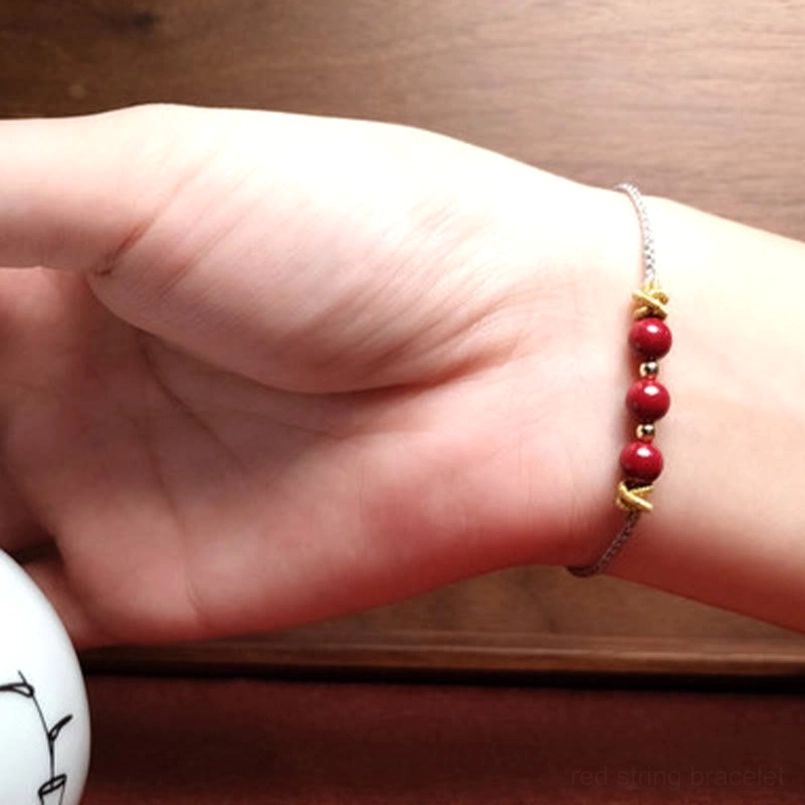Cinnabar bracelet placed on meditation mat spiritual scene