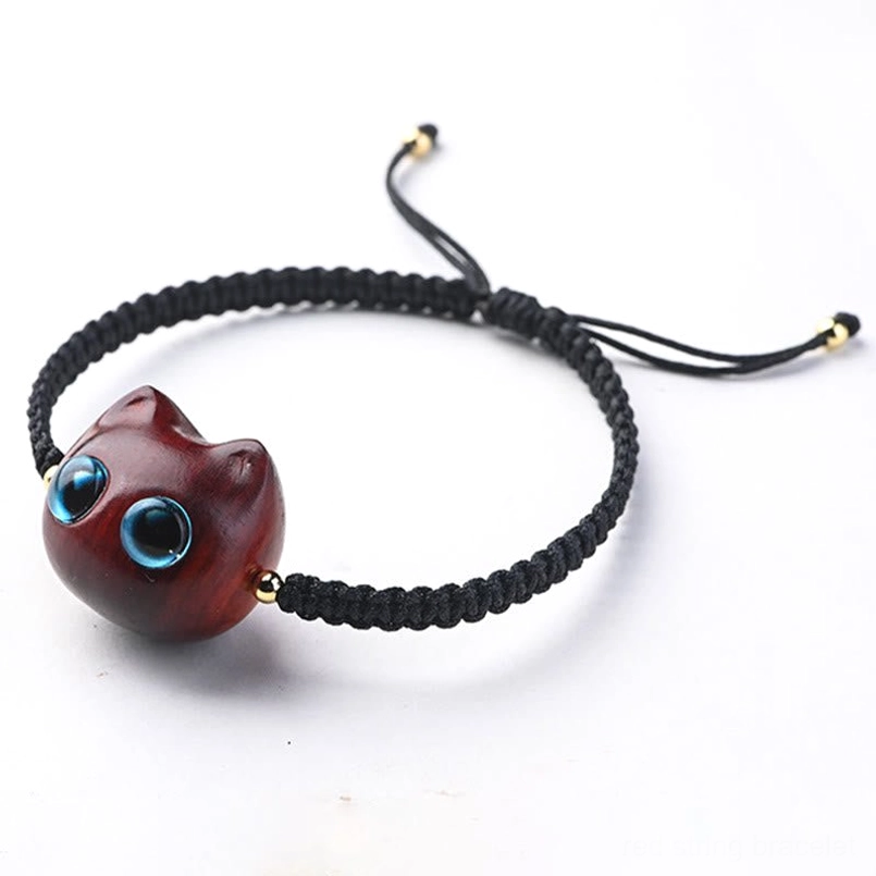 Hand-braided cat charm bracelet with woven cord and gold beads front view