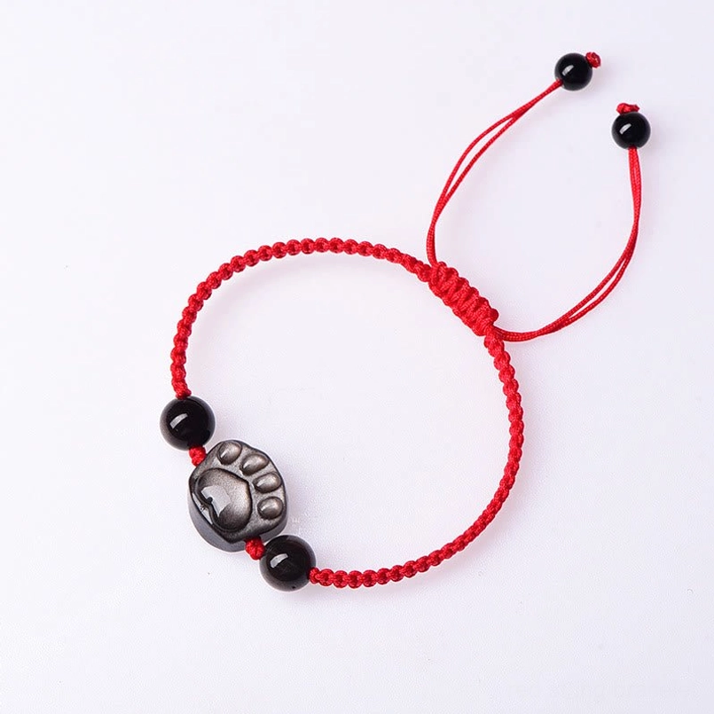Cat paw obsidian red string protection bracelet white background