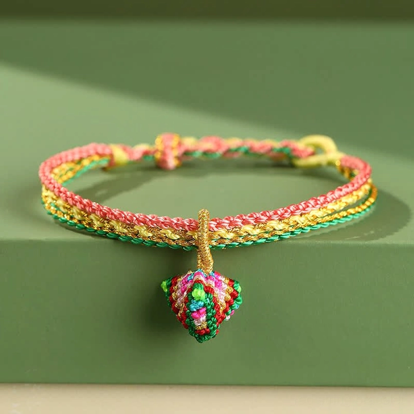 Handcrafted chakra color red string bracelet with adjustable sizing for all wrist circumferences