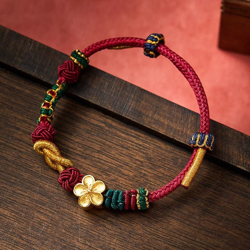 Handmade Chinese knot luck bracelet with multicolor braided decorations and four-leaf pendant