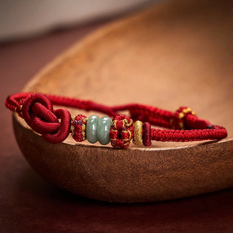 Chinese knot jade bracelet showing jade beads and golden decorative elements