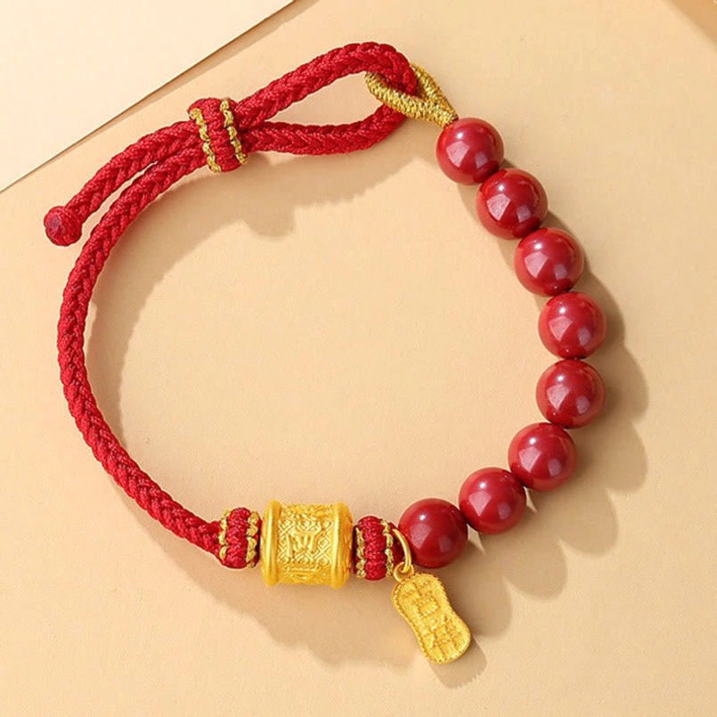 Sterling silver Om Mani Padme Hum bracelet with cinnabar beads, side view on minimalist background