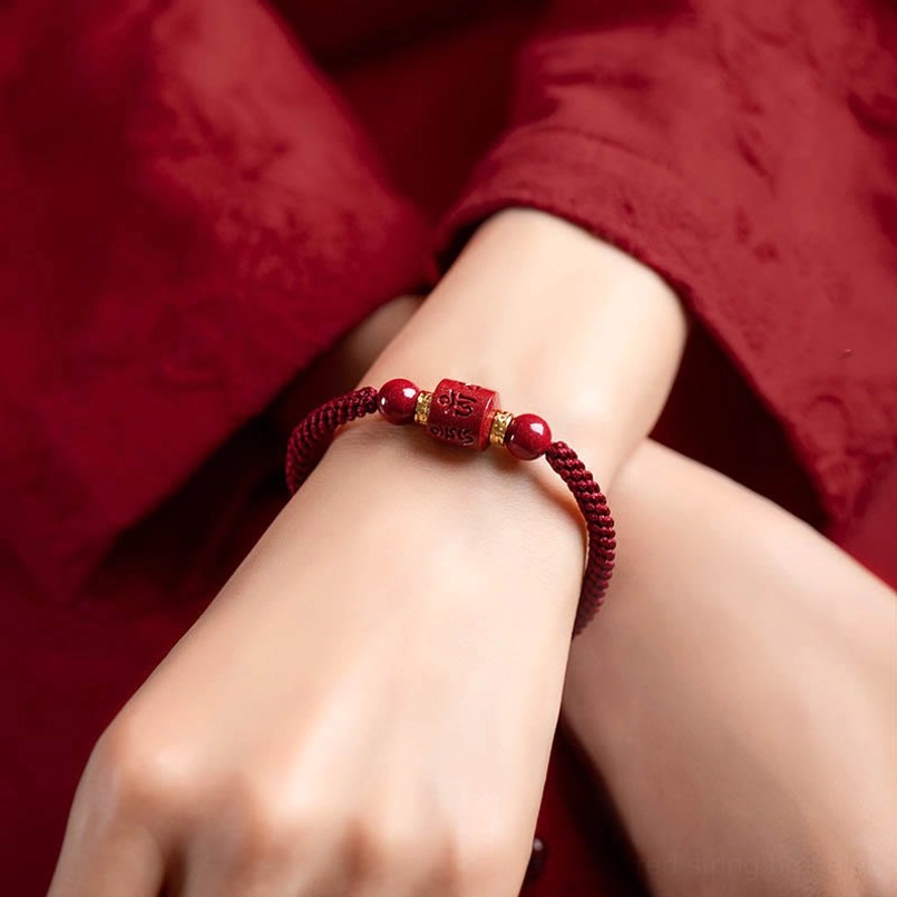Wearing om mani padme hum cinnabar bracelet on wrist natural fit