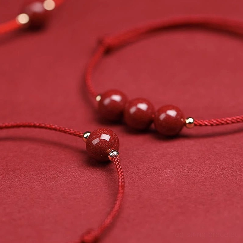 Cinnabar bead red string bracelet with adjustable sizing shown