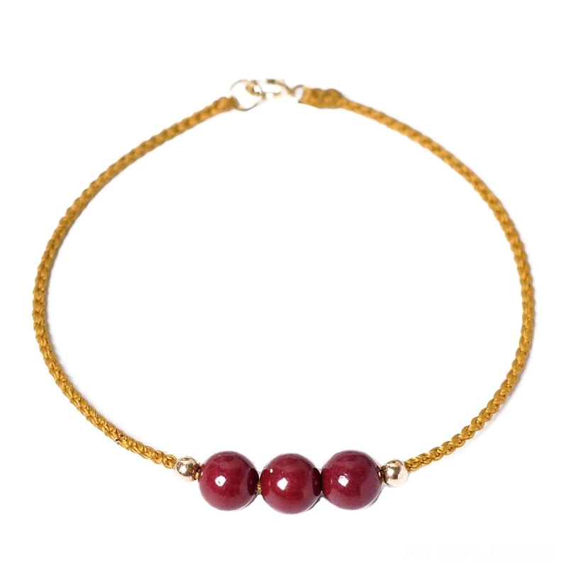 14K gold plated cinnabar bracelet flat lay view pure white background