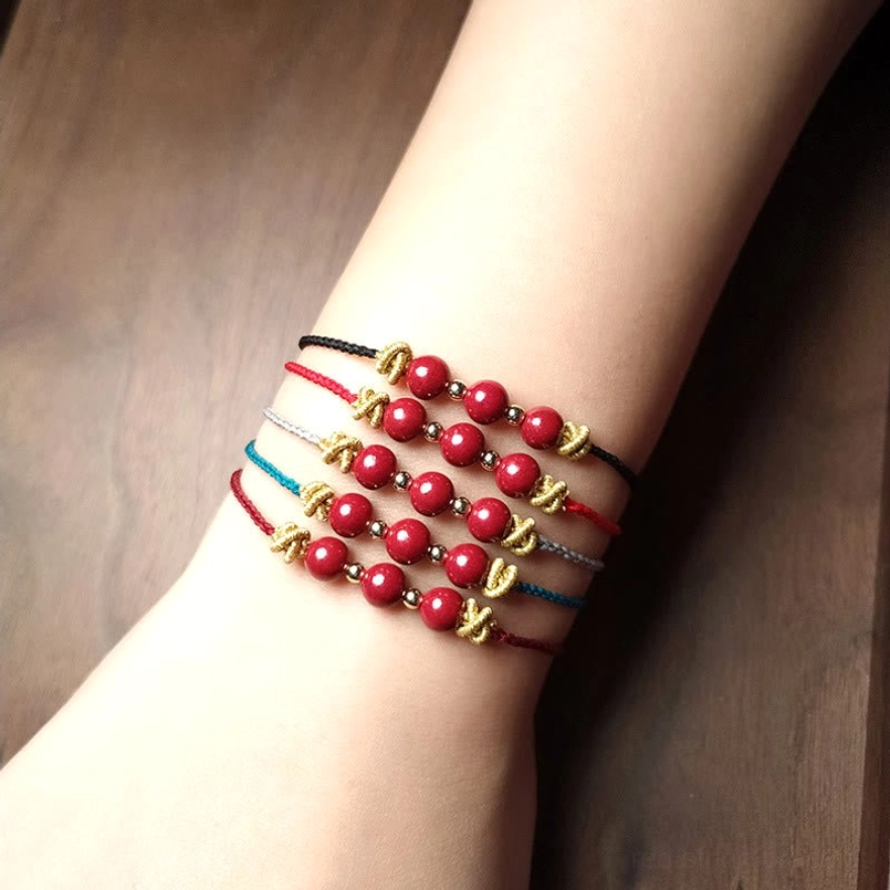 Cinnabar string bracelet product shot with natural sunlight lighting