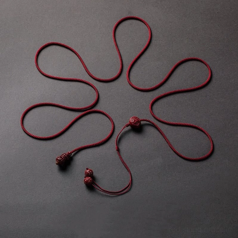 Cinnabar red string belly chain styled with denim for casual body-positive fashion wear