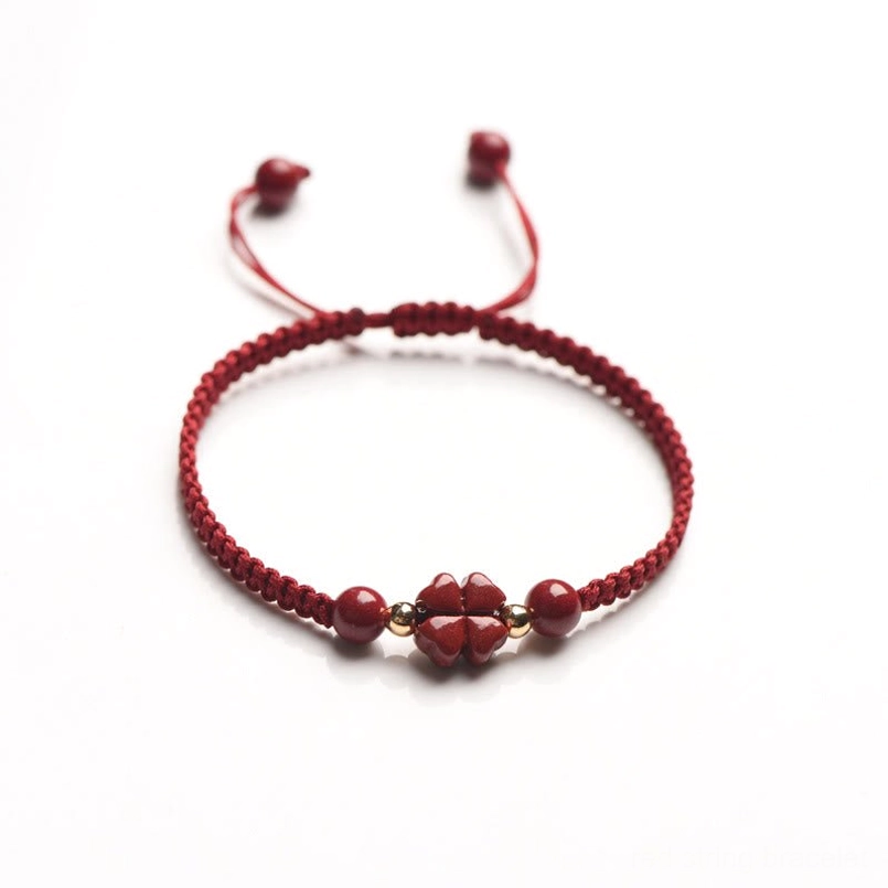 Cinnabar four-leaf clover red string bracelet product lifestyle shot