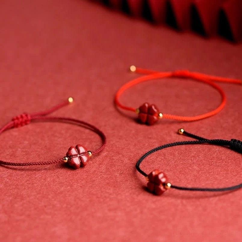 Cinnabar four leaf clover red string bracelet with golden bead accent luxury option