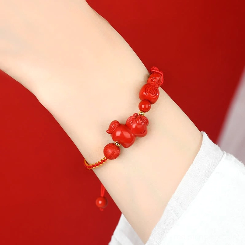 Cinnabar Horse Fu red bracelet close up on arm wearing view