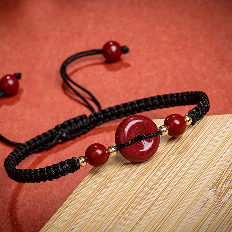 Black woven cord cinnabar peace buckle bracelet polished finish