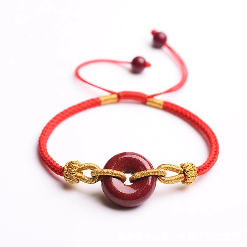Cinnabar peace buckle red string bracelet top view with adjustable cord system