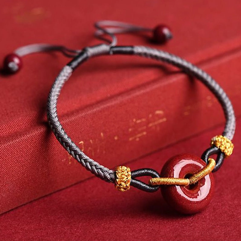 Handmade cinnabar peace buckle bracelet showcasing natural stone and craftsmanship