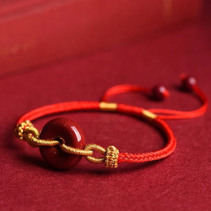 Cinnabar peace buckle bracelet front view with gold decorative elements