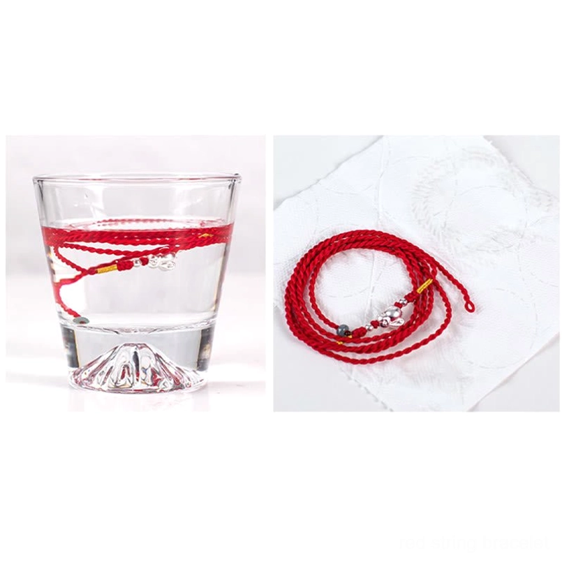 Cinnabar peace buckle waist chain draped display showing craftsmanship and material quality